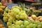 Close-up of a white grape cluster at a market stall