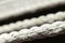 Close-up of a white hammock rope with selective focus; nautical boat ropes