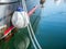 Close up with a white mooring ball and sailing rope