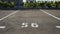 Close-up of a white paint number marking in a parking lot. Empty parking lot, Parking lot with white mark, Open parking in public