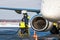 Close-up of a white passenger airplane refueling