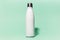 Close-up of white reusable steel stainless thermo water bottle isolated on background of aqua menthe color. Plastic free.