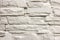 Close-up of white solid limestone wall or stone fence. Abstract copy space background, Bricklaying, construction and masonry