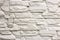 Close-up of white solid limestone wall or stone fence. Abstract copy space background, Bricklaying, construction and masonry