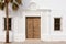 close-up of a whitewashed spanish revival doorway
