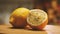 Close-up of whole and cut in half lemons lying on a kitchen board. The camera flies around. Parallax effect