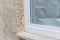 Close-up of a window in the shell with construction foam and window sill, Germany