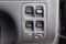 Close-up on windows control buttons near the door in the interior of an old Japanese car in gray after cleaning