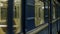 Close up for windows of the underground carriage at the subway station. Moving windows of an empty metro train.