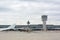 Close up of Wing of Airplane on Airplane waiting for Maintenance at the Airport Background