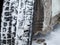 Close-up of a winter car tire tread with snow and ice