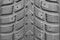 Close-up winter tire tread. Textured tire tread. Part of brand new modern winter car tire