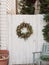 close up of winter wreathe door outside wooden white circle ornament decoration