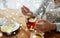 Close up of woman adding honey to tea with lemon