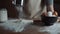 Close up woman bakery chef sifting flour from sieve on table, preparing for making homemade bread. Slow motion shot.