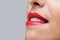 Close up woman biting her red lips