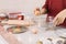 Close-up of woman breaking egg into a bowl