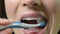 Close Up Of Woman Brushing Teeth With Manual Toothbrush