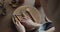 Close-up of woman carpenter`s hand choosing tools for carving wood