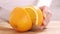 Close up on a woman carving a orange