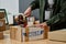 Close-up of woman with cellotape sealing cardboard box with humanitarian help