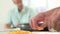 Close Up Of Woman Chopping Peppers And Adding To Frying Pan