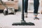 Close up. Woman Cleans Carpet with Vacuum Cleaner.