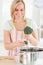 Close up of a woman cooking broccoli