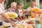 Close up of a woman dishing out a food