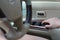 Close up woman driver`s hand pressing on button automatic power controlling window in car