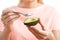 Close Up Of Woman Eating Avocado With Spoon