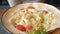 Close up of woman eating caesar salad in a cafe