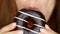 Close-up woman eating chocolate, donut , delicious, sweet, sweet tooth. Diet. Dieting. Female mouth bites a dessert.