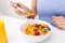 Close up of woman eating corn flakes for breakfast