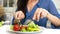 Close up on a woman eating her salad