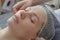 Close-up woman face in beauty spa on couch. Relaxation, rejuvenation