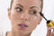 Close up of woman face with mascara brush