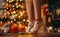 Close-up of woman feet in christmas socks, decorating a festive Christmas tree with colorful ornaments. Generative Ai