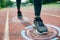 Close up of woman feet running on track