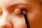 Close up woman getting make up, eyeshadow