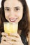 Close up of woman with a glass of banana smoothie