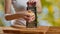 Close-up of a woman grating parmesan cheese.