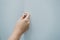 Close-Up of Woman Hand is Opening Door Cabinet in Kitchen Room, Female Hands is Pulling Wooden Door Cupboard in Pantry Room.