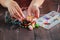 Close up of woman hand threading beads