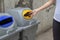 Close up woman hand throwing empty plastic bottle drop in recycling bin , Save the world concept