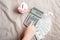 Close-Up of Woman Hand is Using Calculator for Calculated Accounting Money Saving or Expense Claim on Her Bedroom, Business