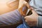 Close up of woman hands fasten belts while sitting on airplane s