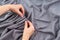 Close up of woman hands hanging curtain