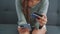 Close up of woman hands holding credit card and smartphone. Young woman paying online using banking entering data shopping order