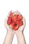 Close-up woman hands holding strawberries on white background